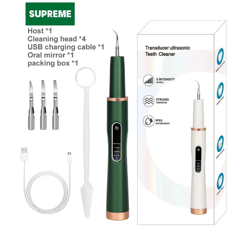 Dog and cat ultrasonic tooth cleaner kit with accessories, including charging cable and multiple cleaning tips.